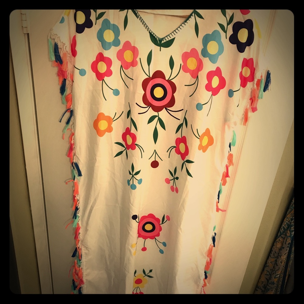 Mexican inspired dress with colorful tassels.